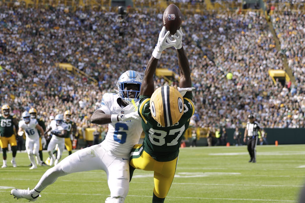 Green Bay Packers wide receiver Romeo Doubs (87) and Detroit Lions cornerback Terrion Arnold (6) show off their athleticism on Sept. 7, 2025.