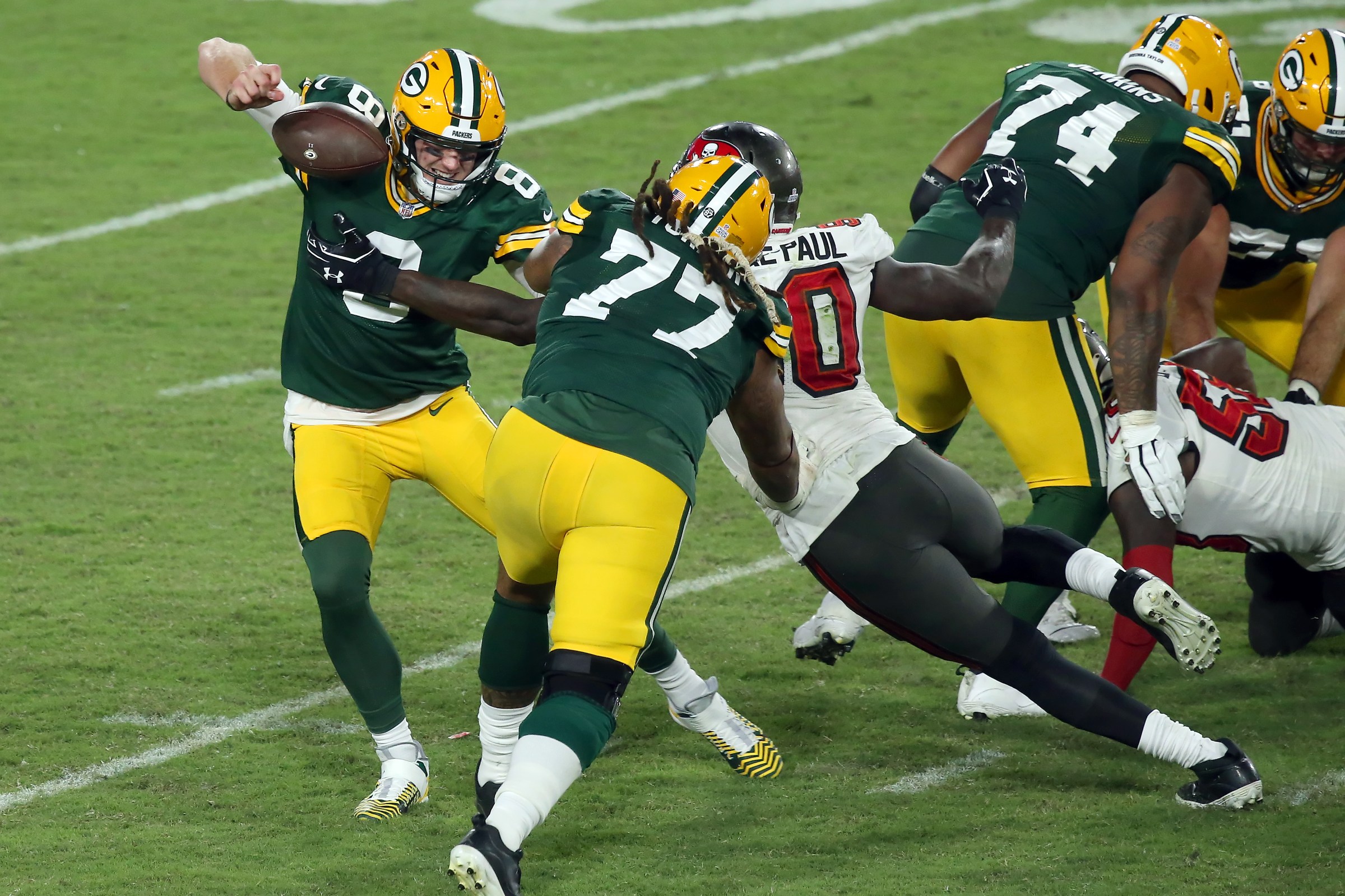 TAMPA, FL - OCTOBER 18: Jason Pierre-Paul (90) of hte Buccaneers forces a fumble from Packers quarterback Tim Boyle (8) Billy Turner (77) attempts to block JPP during the regular season game between the Green Bay Packers and the Tampa Bay Buccaneers on October 18, 2020 at Raymond James Stadium in Tampa, Florida. (Photo by Cliff Welch/Icon Sportswire via Getty Images)