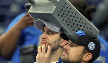 The Bears’ players are all wearing cheese grater hats