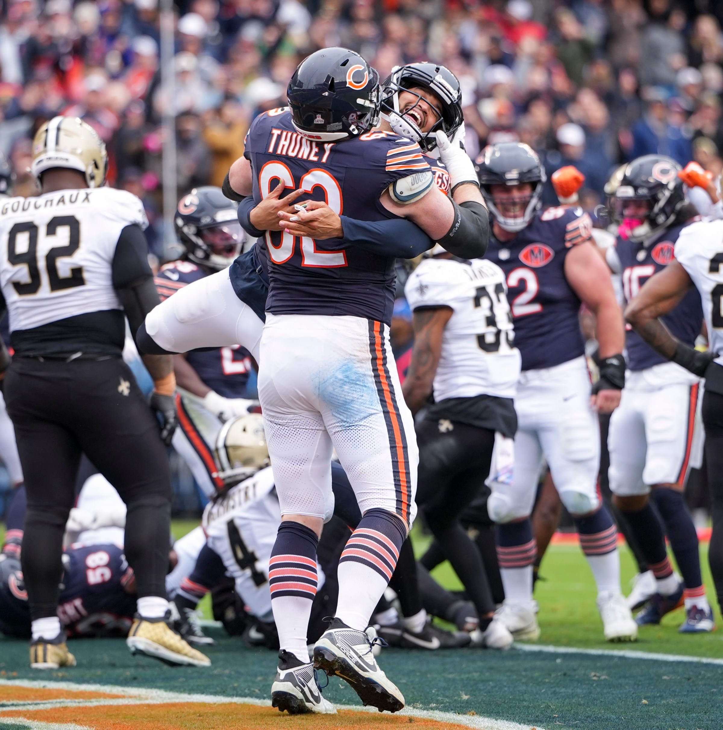 CHICAGO, ILLINOIS - OCTOBER 19: Joe Thuney #62 and Caleb Williams #18 of the Chicago Bears celebrate a play during an NFL football game against the New Orleans Saints at Solider Field on October 19, 2025 in Chicago, Illinois. (Photo by Todd Rosenberg/Getty Images)