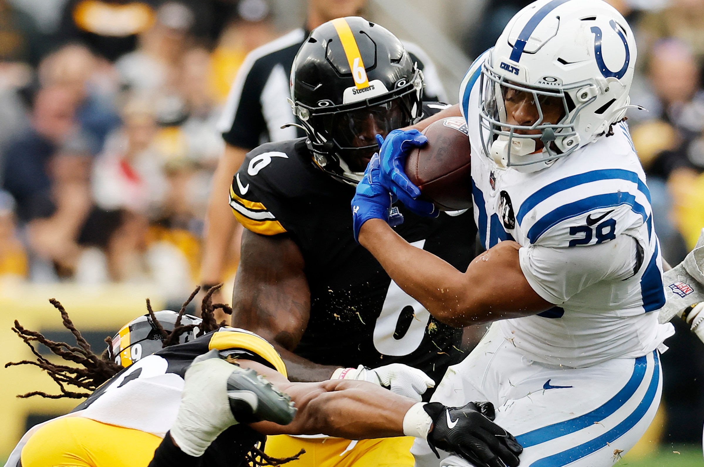 PITTSBURGH, PENNSYLVANIA - NOVEMBER 02: Jonathan Taylor #28 of the Indianapolis Colts is tackled by Kyle Dugger #29 of the Pittsburgh Steelers and Patrick Queen #6 of the Pittsburgh Steelers during the second quarter in the game at Acrisure Stadium on November 02, 2025 in Pittsburgh, Pennsylvania. (Photo by Justin K. Aller/Getty Images)
