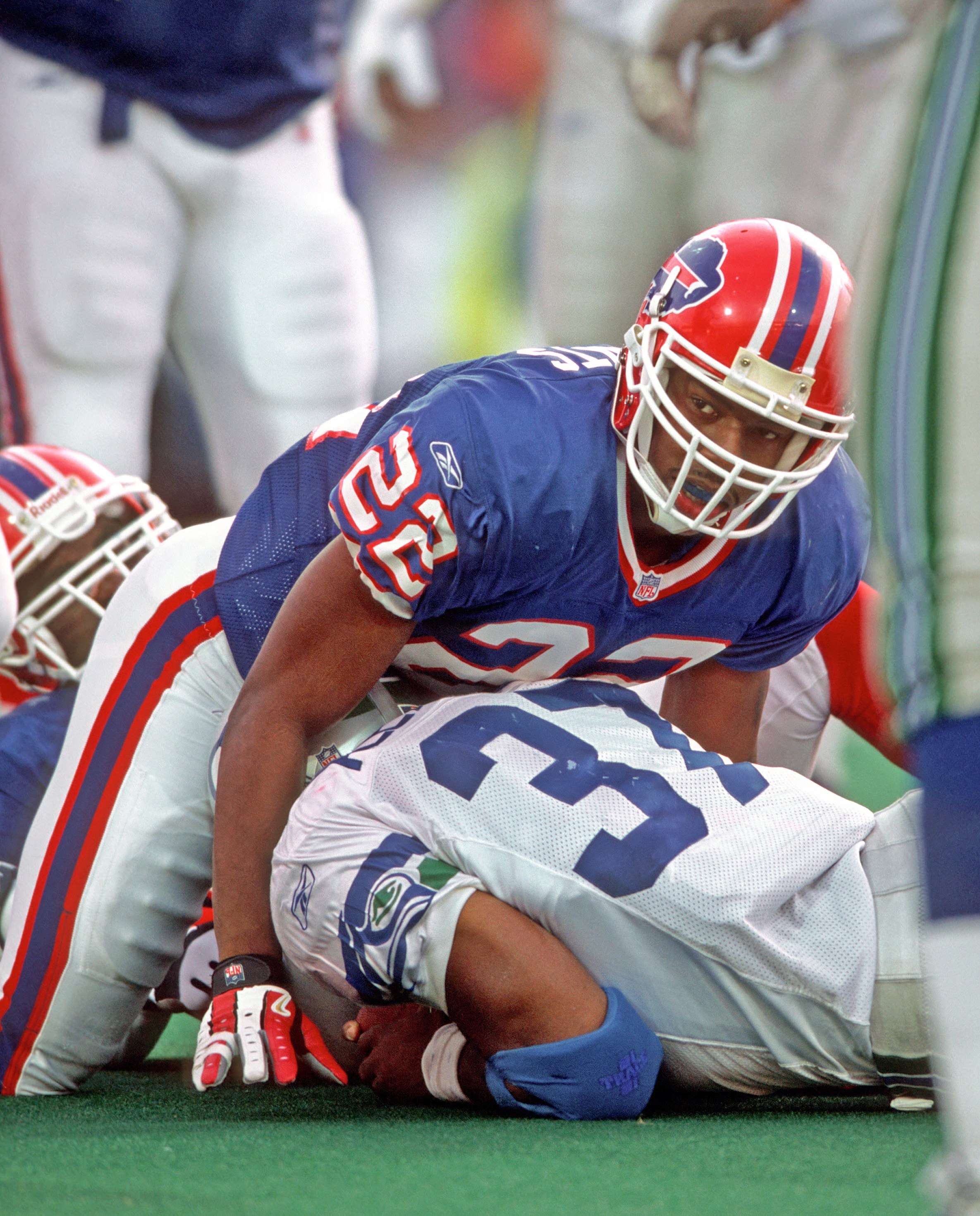 ORCHARD PARK, NY - NOVEMBER 18: Cornerback Nate Clements #22 of the Buffalo Bills looks up after he tackled running back Shaun Alexander #37 of the Seattle Seahawks during a game at Ralph Wilson Stadium on November 18, 2001 in Orchard Park, New York. The Seahawks defeated the Bills 23-20. (Photo by George Gojkovich/Getty Images)