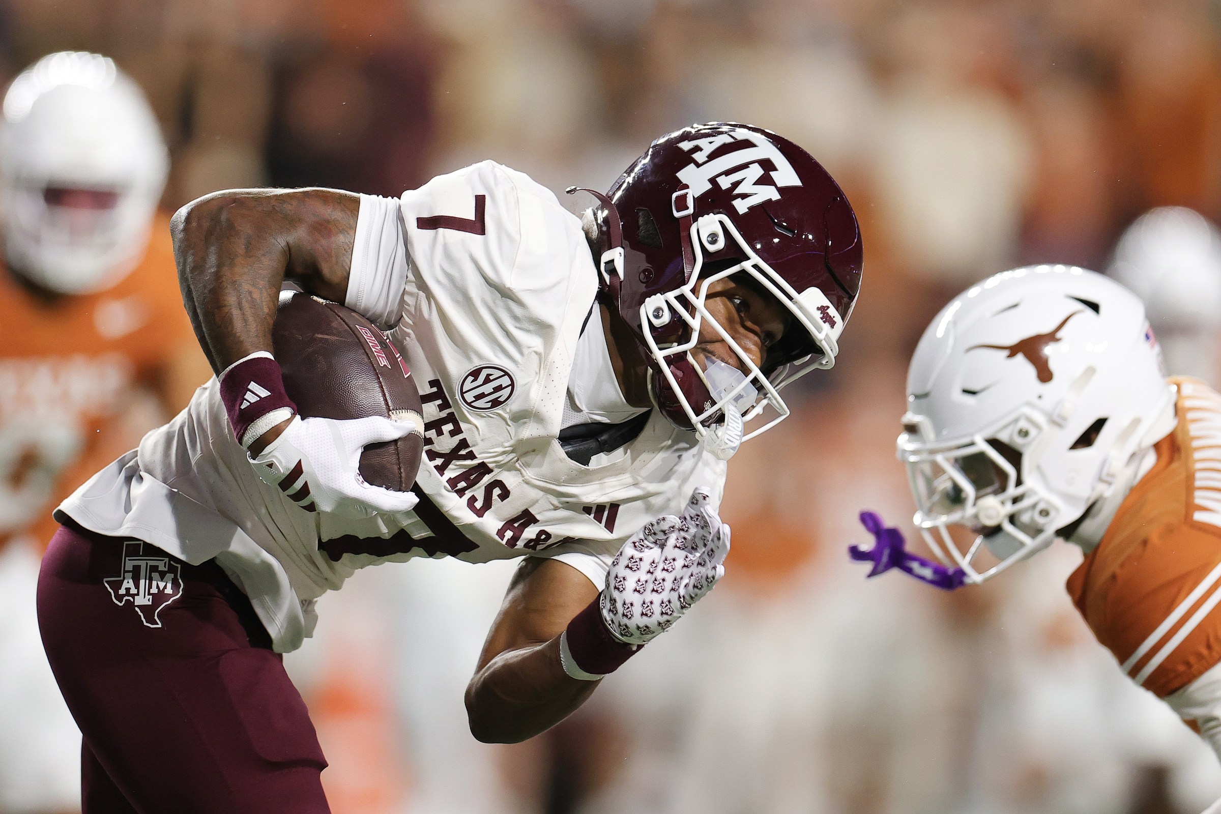 AUSTIN, TEXAS - NOVEMBER 28: KC Concepcion #7 of the Texas A&M Aggies runs with the ball against the Texas Longhorns during the first quarter at Darrell K Royal-Texas Memorial Stadium on November 28, 2025 in Austin, Texas. (Photo by Alex Slitz/Getty Images)