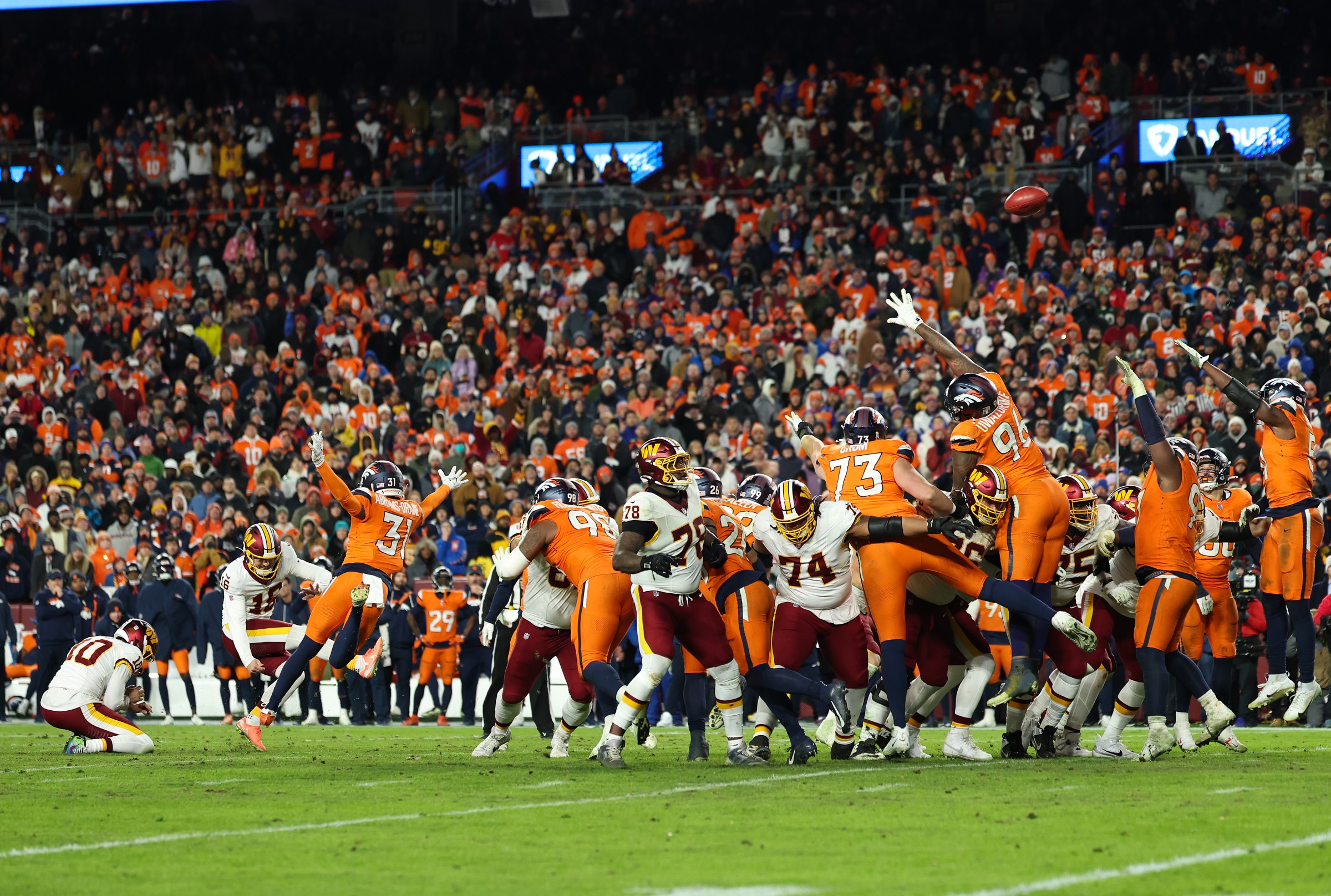 LANDOVER, MARYLAND - NOVEMBER 30: Jake Moody #16 of the Washington Commanders kicks a game-tying field goal at the end of the fourth quarter against the Denver Broncos at Northwest Stadium on November 30, 2025 in Landover, Maryland. (Photo by Scott Taetsch/Getty Images)