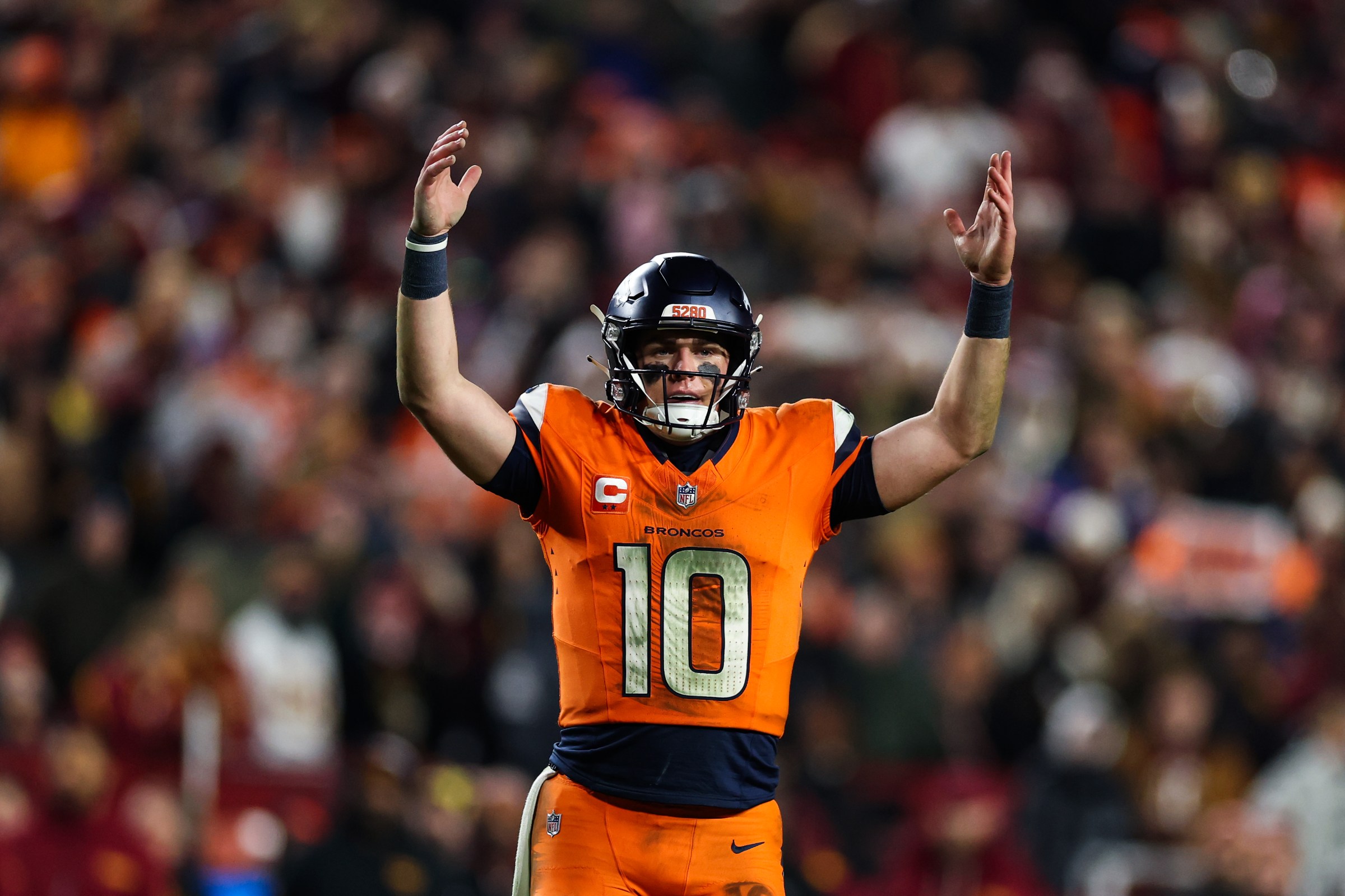 LANDOVER, MARYLAND - NOVEMBER 30: Bo Nix #10 of the Denver Broncos reacts against the Washington Commanders during the third quarter at Northwest Stadium on November 30, 2025 in Landover, Maryland. (Photo by Patrick Smith/Getty Images)