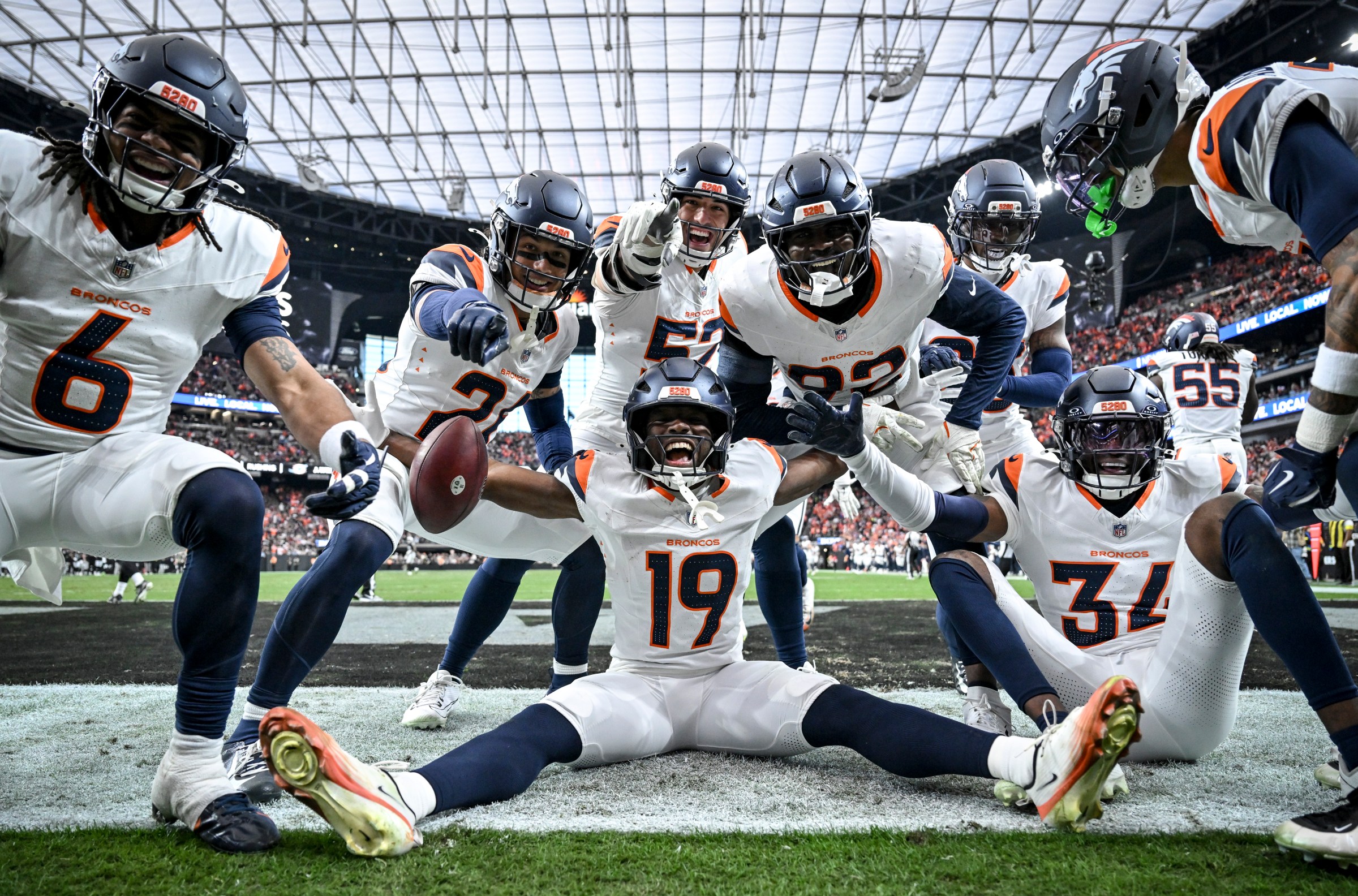 LAS VEGAS , NV - DECEMBER 7: Marvin Mims Jr. (19) of the Denver Broncos celebrates taking a punt return to the house with fellow special team members against the Las Vegas Raiders during the second quarter at Allegiant Stadium in Las Vegas, Nevada on Sunday, December 7, 2025. (Photo by AAron Ontiveroz/The Denver Post)
