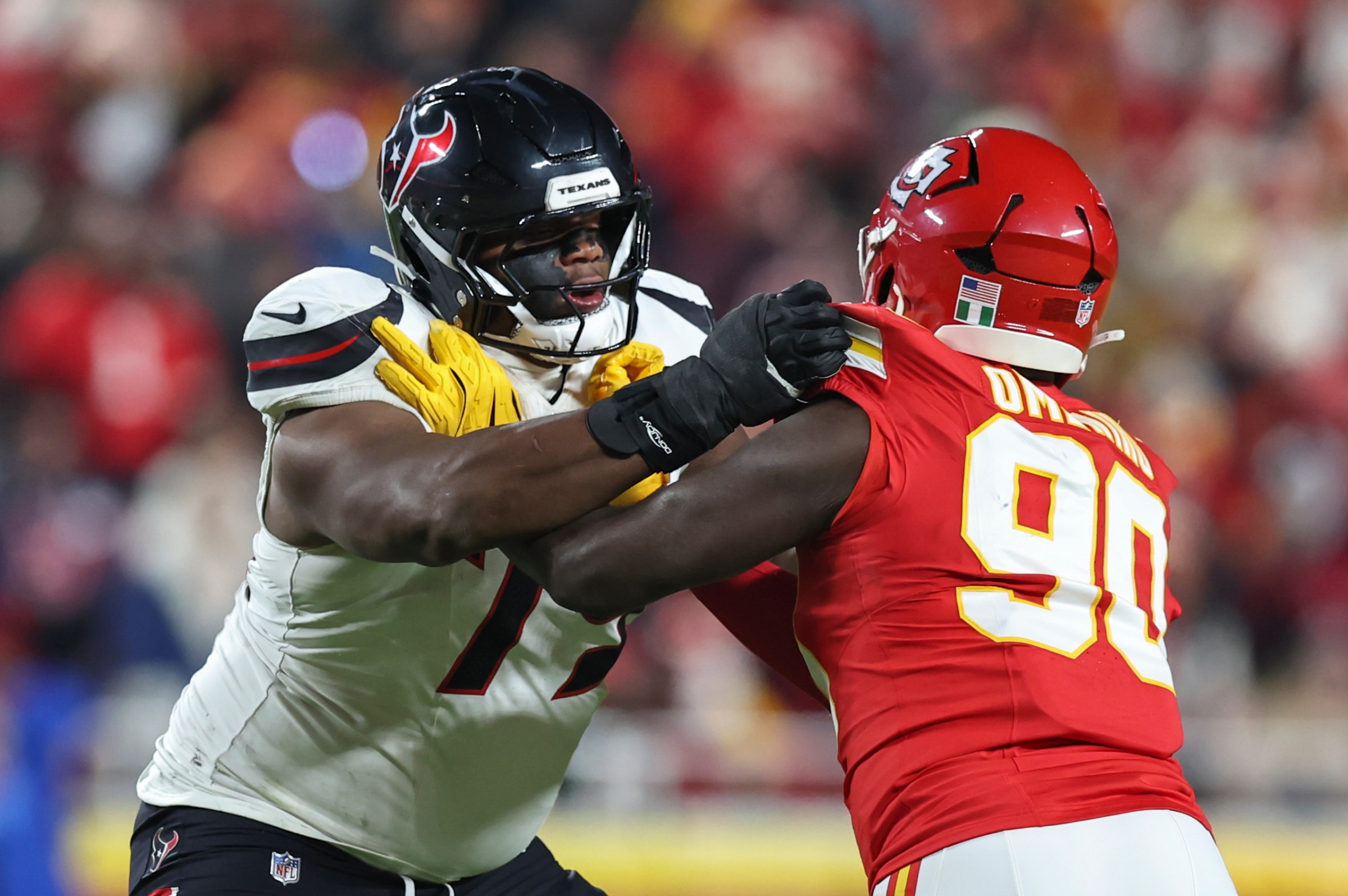 KANSAS CITY, MO - DECEMBER 07: Houston Texans offensive tackle Aireontae Ersery (79) blocks Kansas City Chiefs defensive end Charles Omenihu (90) in the second quarter of an NFL game between the Houston Texans and Kansas City Chiefs on December 7, 2025 at GEHA Field at Arrowhead Stadium in Kansas City, MO. (Photo by Scott Winters/Icon Sportswire via Getty Images)
