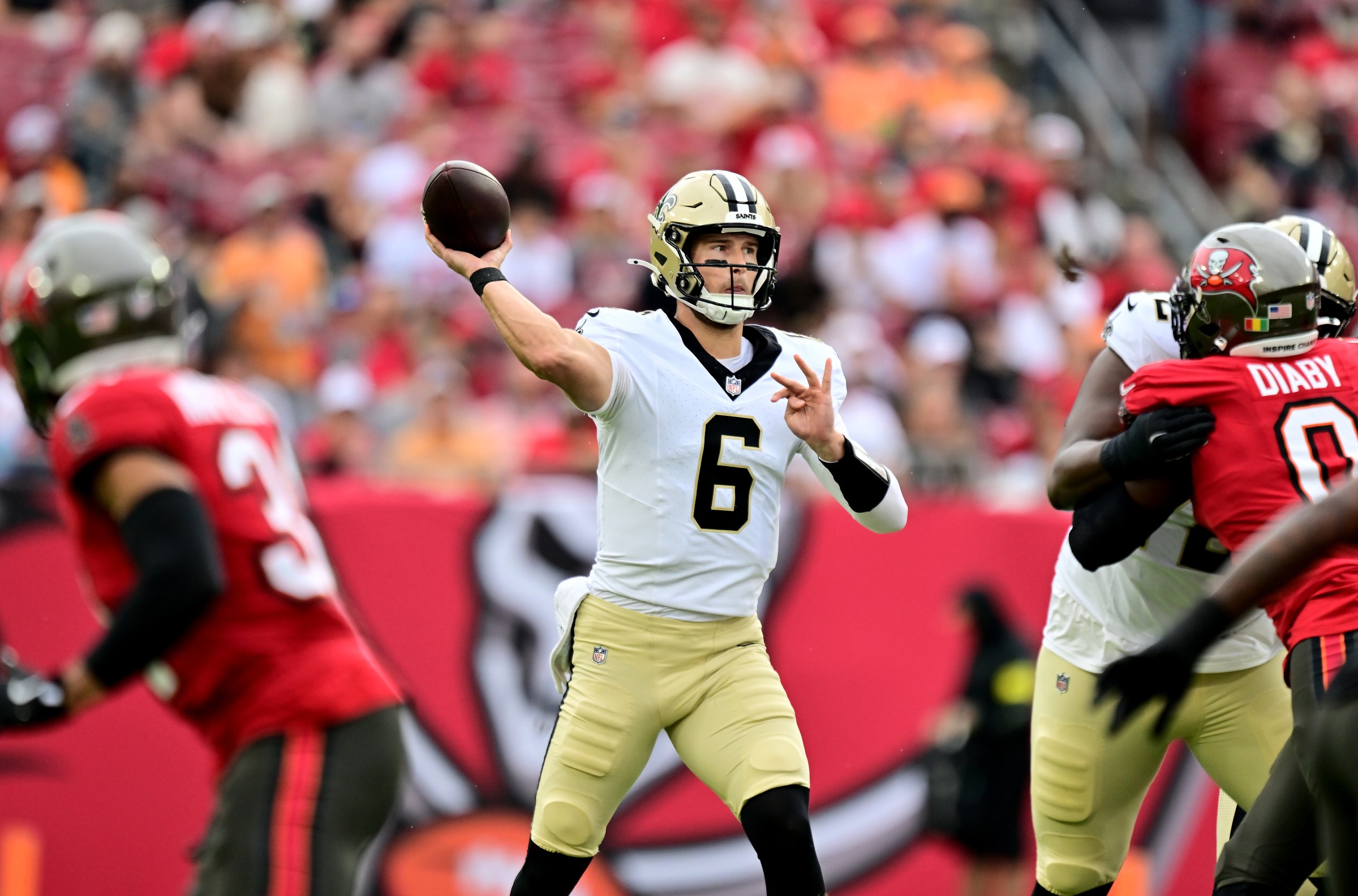 TAMPA, FLORIDA - DECEMBER 07: Tyler Shough #6 of the New Orleans Saints passes the ball against the Tampa Bay Buccaneers during the first quarter at Raymond James Stadium on December 07, 2025 in Tampa, Florida. (Photo by Julio Aguilar/Getty Images)