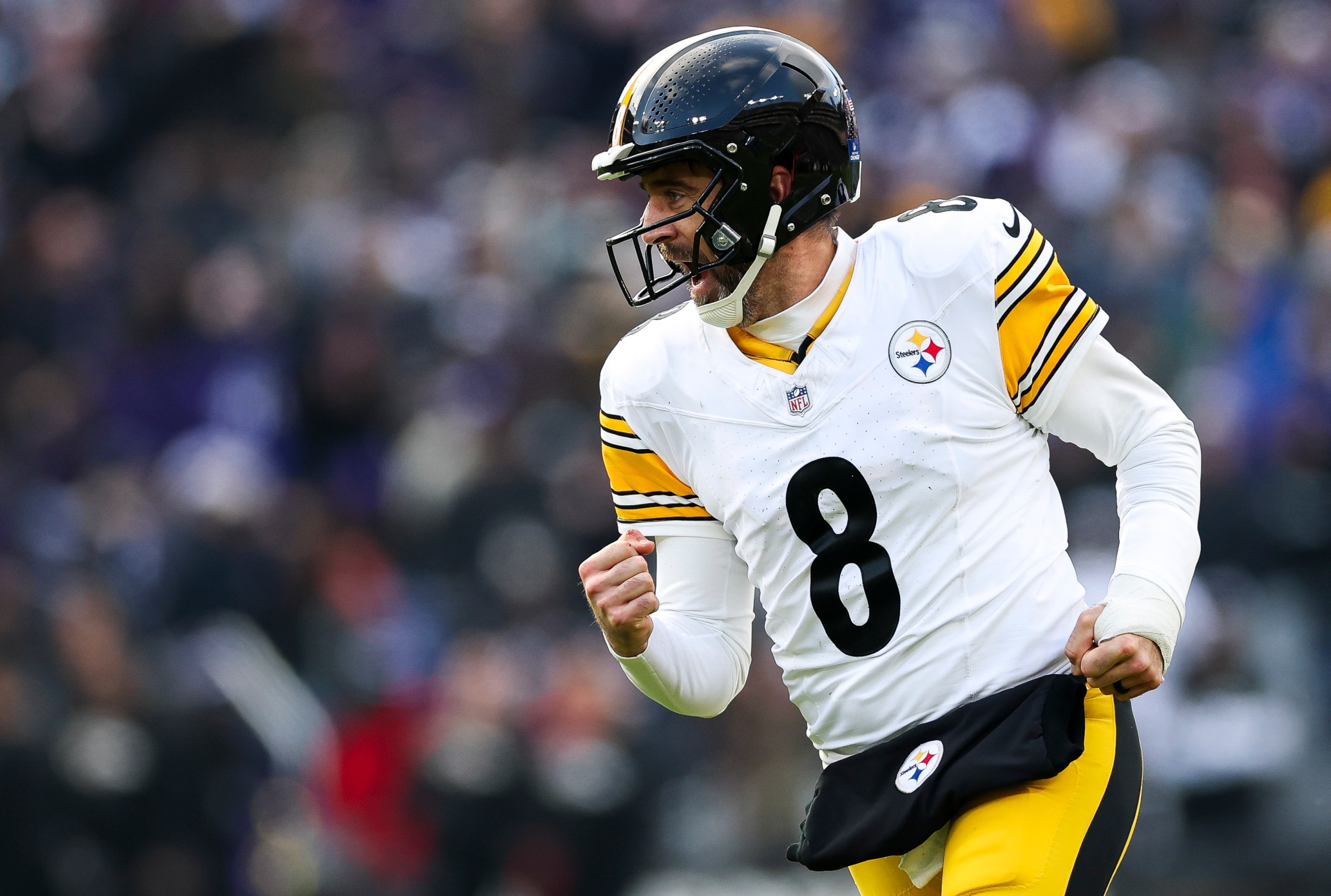 BALTIMORE, MARYLAND - DECEMBER 07: Aaron Rodgers #8 of the Pittsburgh Steelers celebrates a third quarter touchdown against the Baltimore Ravens at M&T Bank Stadium on December 07, 2025 in Baltimore, Maryland. (Photo by Patrick Smith/Getty Images)