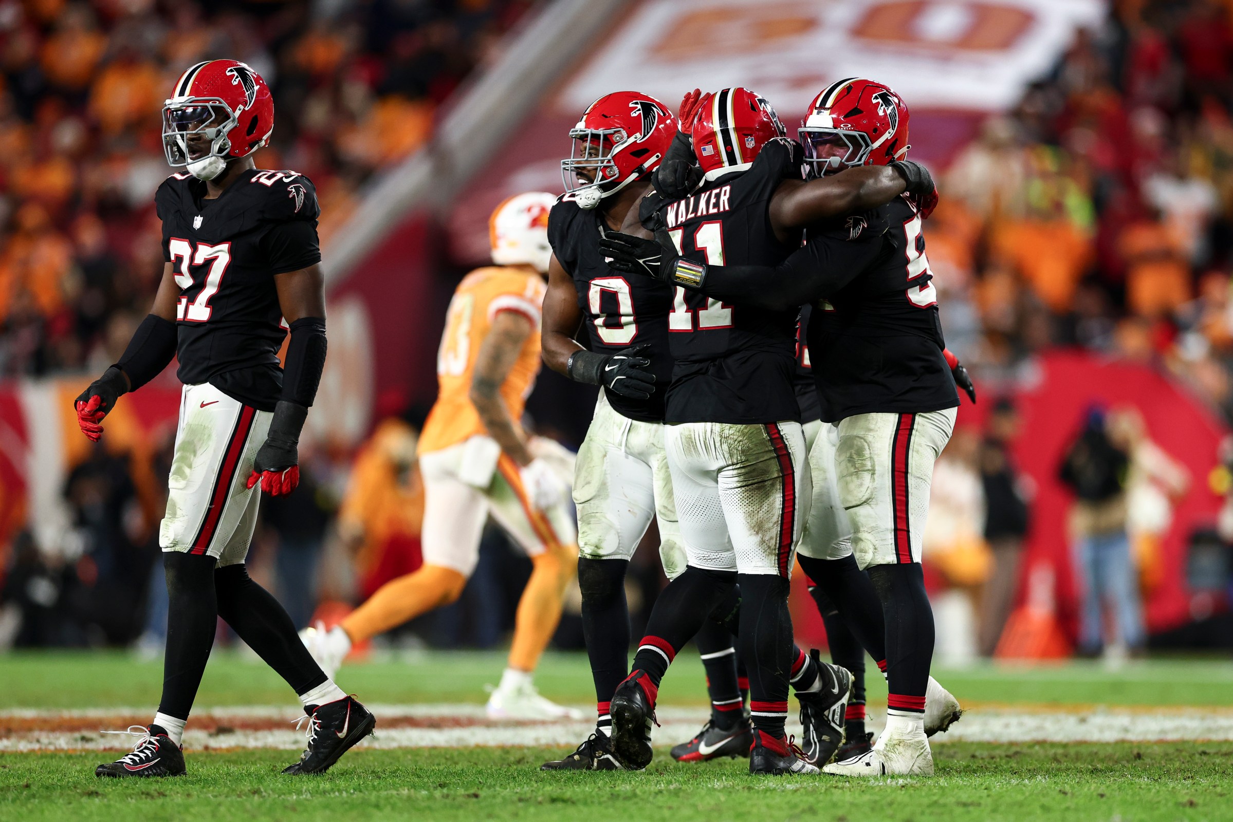 TAMPA, FLORIDA - DECEMBER 11: Jalon Walker #11 of the Atlanta Falcons celebrates after a sack during the fourth quarter of the NFL game against the Tampa Bay Buccaneers at Raymond James Stadium on December 11, 2025 in Tampa, Florida. (Photo by Kevin Sabitus/Getty Images)