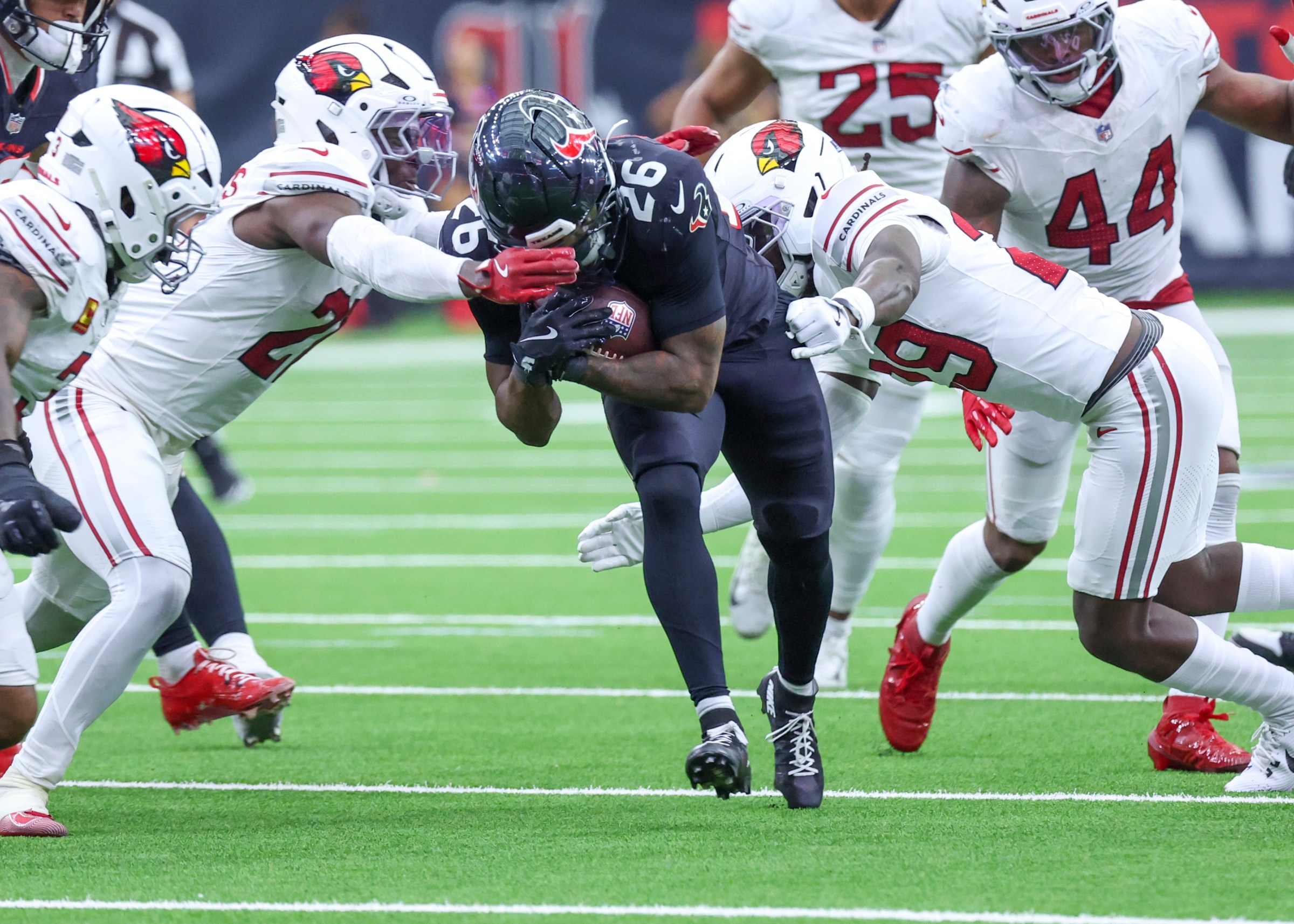 HOUSTON, TX - DECEMBER 14: Houston Texans running back Jawhar Jordan (26) pushes through the defensive line in the fourth quarter during the NFL game between the Arizona Cardinals and Houston Texans on December 14, 2025 at NRG Stadium in Houston, Texas. (Photo by Leslie Plaza Johnson/Icon Sportswire via Getty Images)