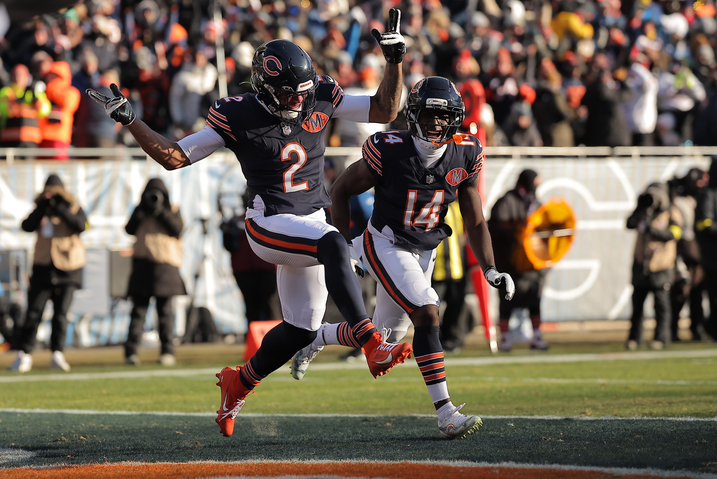 CHICAGO, IL - DECEMBER 14: DJ Moore #2 of the Chicago Bears and Olamide Zaccheaus #14 of the Chicago Bears celebrate after scoring during the second half against the Cleveland Browns on December 14, 2025 at Soldier Field in Chicago Illinois. (Photo by Melissa Tamez/Icon Sportswire via Getty Images)