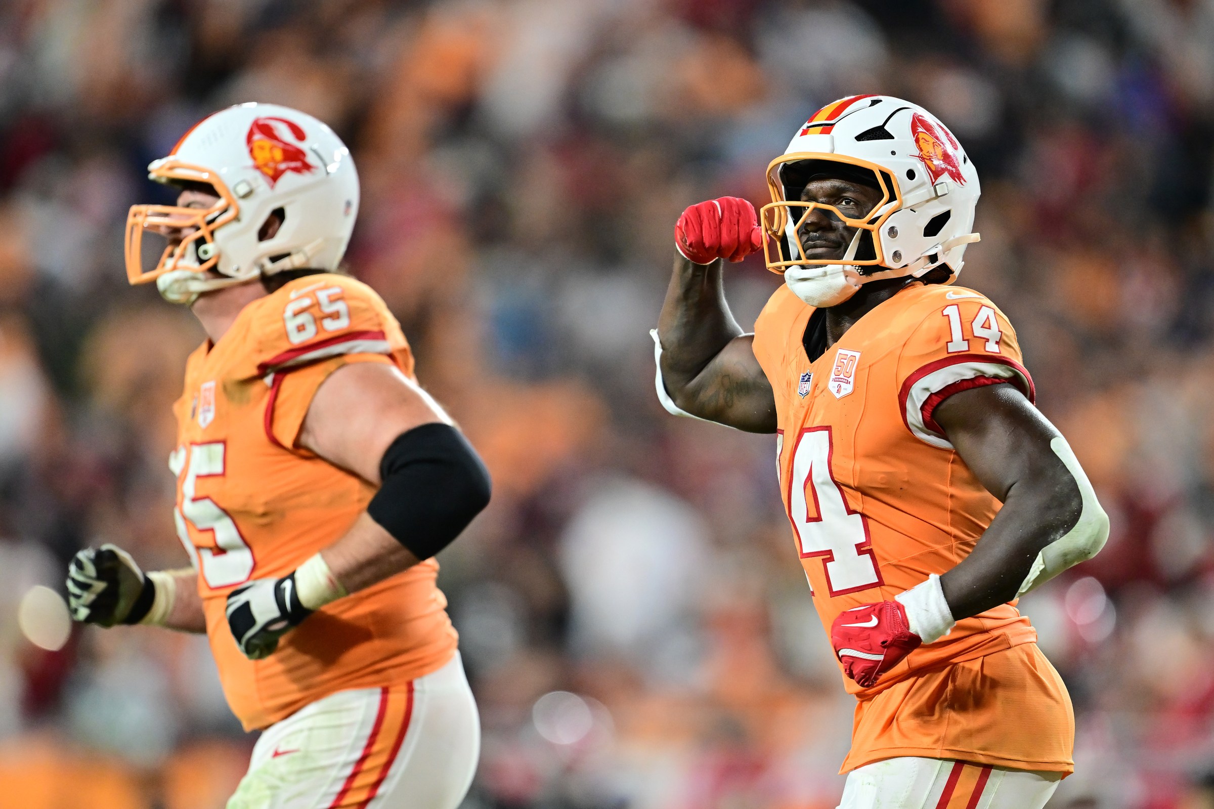 TAMPA, FLORIDA - DECEMBER 11: Chris Godwin Jr. #14 of the Tampa Bay Buccaneers reacts after a two point conversion during the fourth quarter against the Atlanta Falcons at Raymond James Stadium on December 11, 2025 in Tampa, Florida. (Photo by Julio Aguilar/Getty Images)