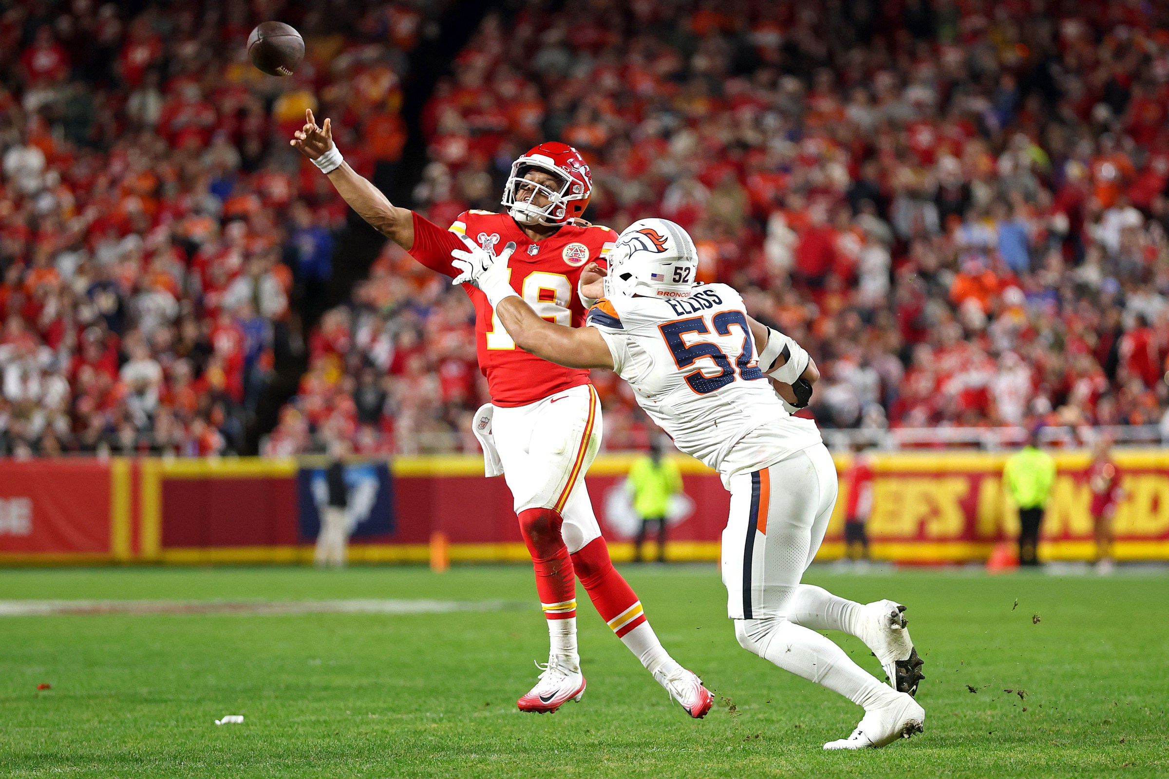 KANSAS CITY, MISSOURI - DECEMBER 25: Chris Oladokun #19 of the Kansas City Chiefs attempts a pass against Jonah Elliss #52 of the Denver Broncos during the second quarter at Arrowhead Stadium on December 25, 2025 in Kansas City, Missouri. (Photo by Jamie Squire/Getty Images)