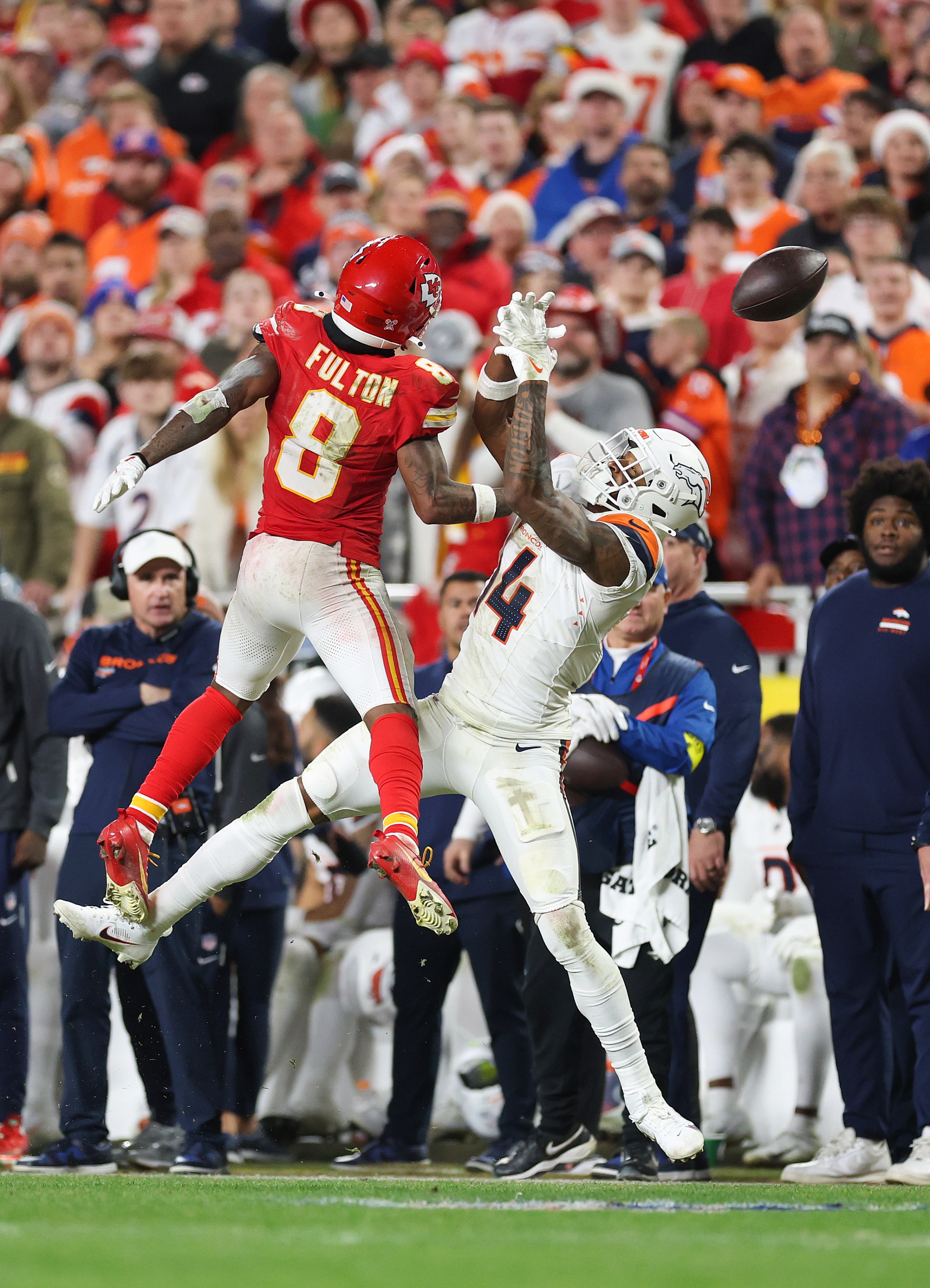 KANSAS CITY, MISSOURI - DECEMBER 25: Kristian Fulton #8 of the Kansas City Chiefs breaks up a pass intended for Courtland Sutton #14 of the Denver Broncos during the fourth quarter at Arrowhead Stadium on December 25, 2025 in Kansas City, Missouri. (Photo by Jamie Squire/Getty Images)