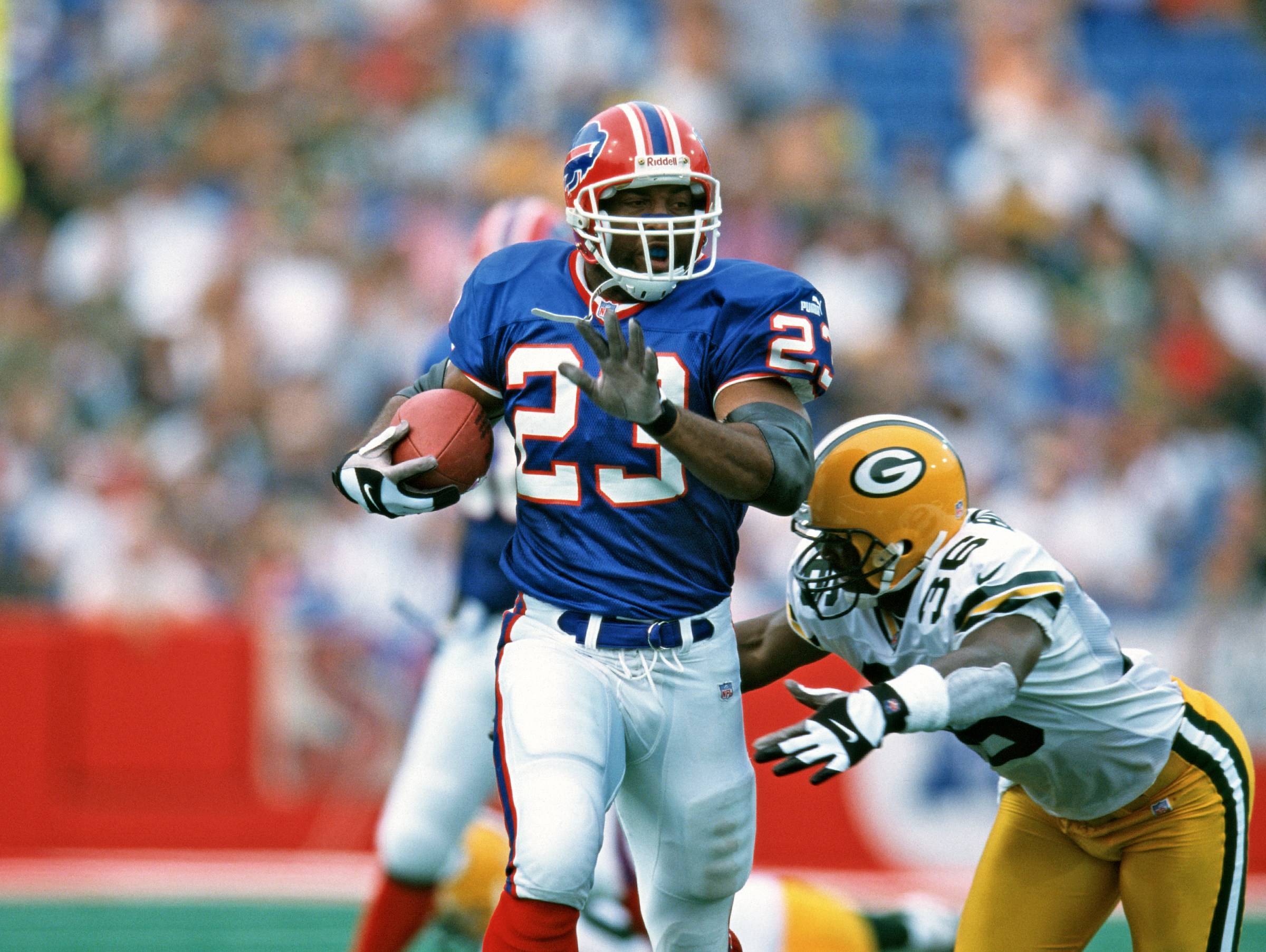 ORCHARD PARK, NY - SEPTEMBER 10: Running back Antowain Smith #23 of the Buffalo Bills runs with the football against defensive back LeRoy Butler #36 of the Green Bay Packers at Ralph Wilson Stadium Stadium on September 10, 2000 in Orchard Park, New York. The Bills defeated the Packers 27-18. (Photo by George Gojkovich/Getty Images)