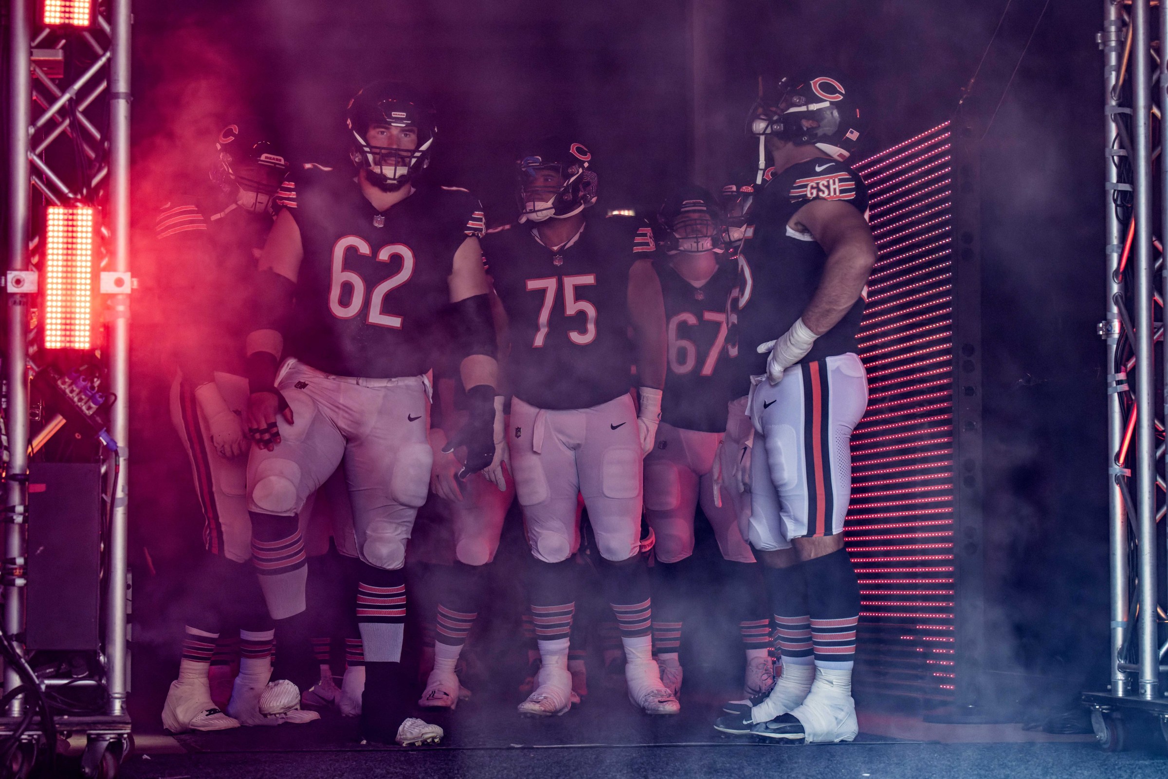 Oct 1, 2023; Chicago, Illinois, USA; Chicago Bears offensive lineman Lucas Patrick (62), offensive lineman Larry Borom (75) and offensive lineman Dan Feeney (67) wait to take the field for a game against the Denver Broncos at Soldier Field. Mandatory Credit: Jamie Sabau-Imagn Images