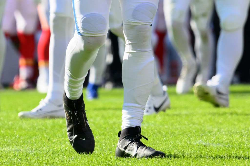 Lower legs of an Indianapolis Colts player wearing a special pad.