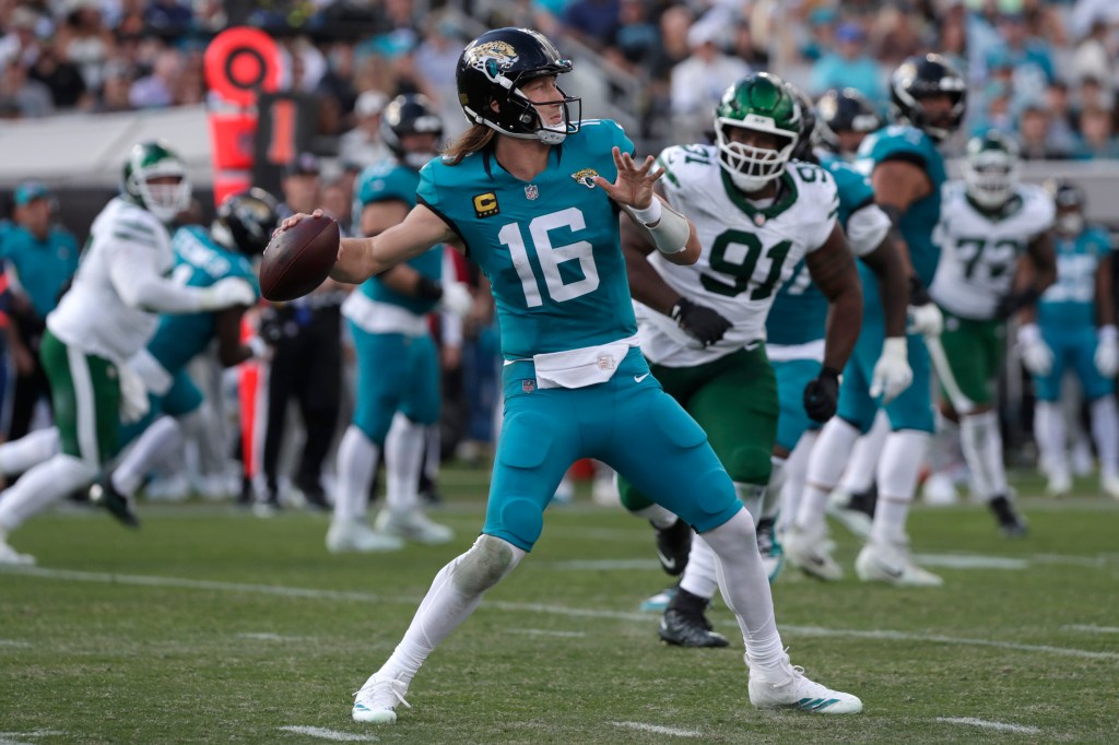 Jacksonville Jaguars quarterback Trevor Lawrence (16) throws the ball during the third quarter against the New York Jets.