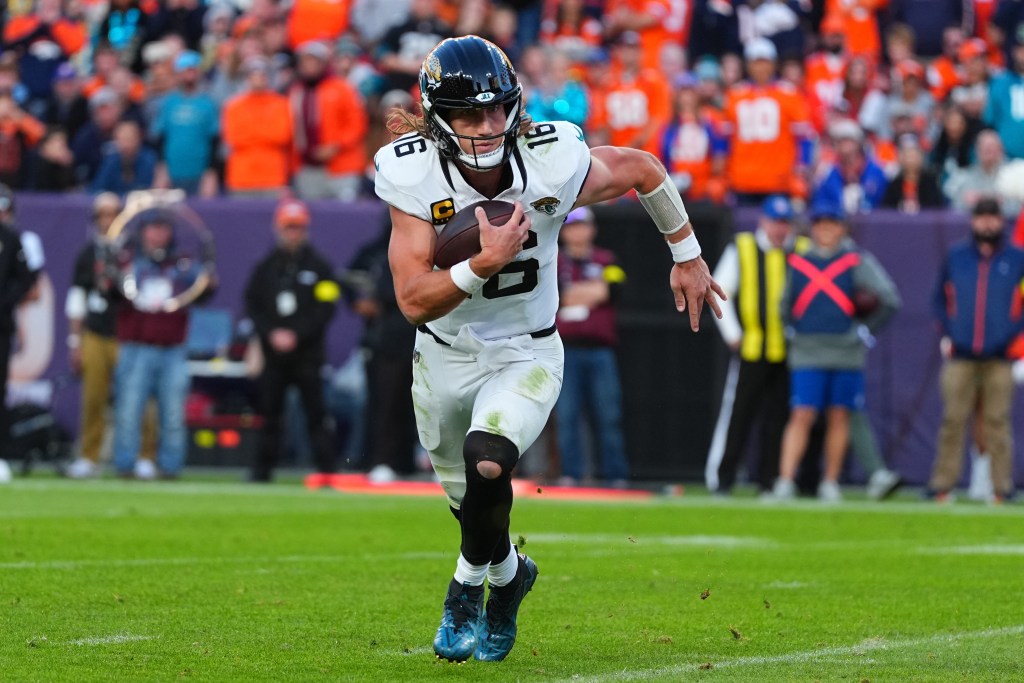 Jacksonville Jaguars quarterback Trevor Lawrence runs for a touchdown against the Denver Broncos.
