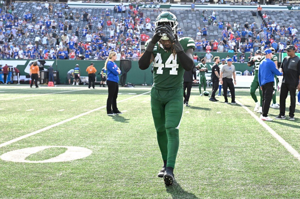Jets linebacker Jamien Sherwood (44) comes off the field after a loss.