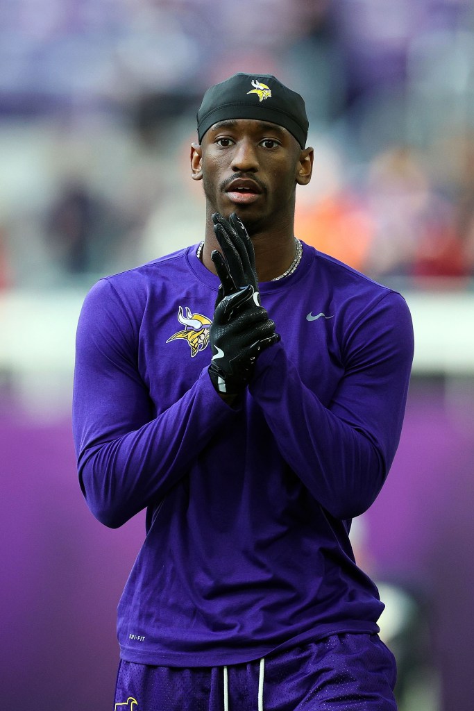 Jordan Addison, #3 of the Minnesota Vikings, looking on.