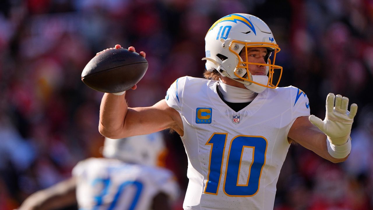 Los Angeles Chargers quarterback Justin Herbert throws during the first half of an NFL football game against the Kansas City Chiefs Sunday, Dec. 14, 2025, in Kansas City, Mo. (AP Photo/Charlie Riedel)