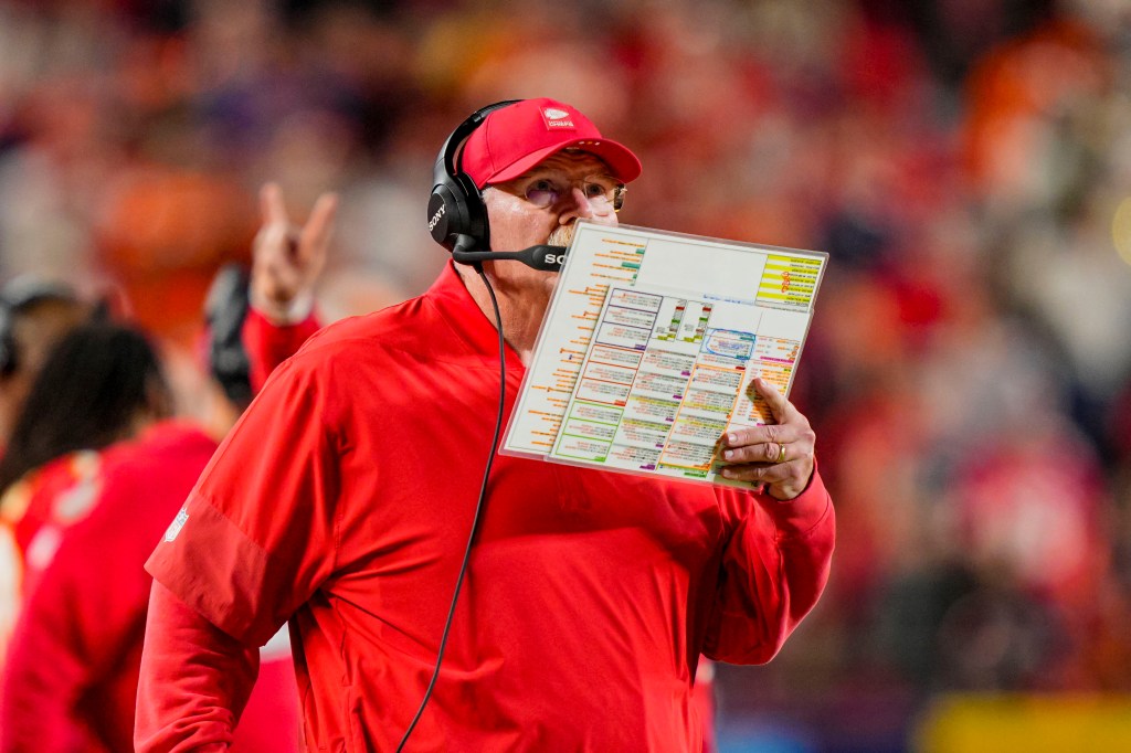 Kansas City Chiefs coach Andy Reid holding a play sheet during the game.