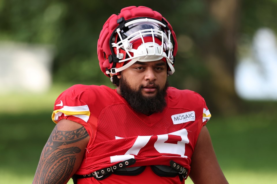 Kansas City Chiefs offensive tackle Esa Pole (79) walks to the field before the start of practice during training camp