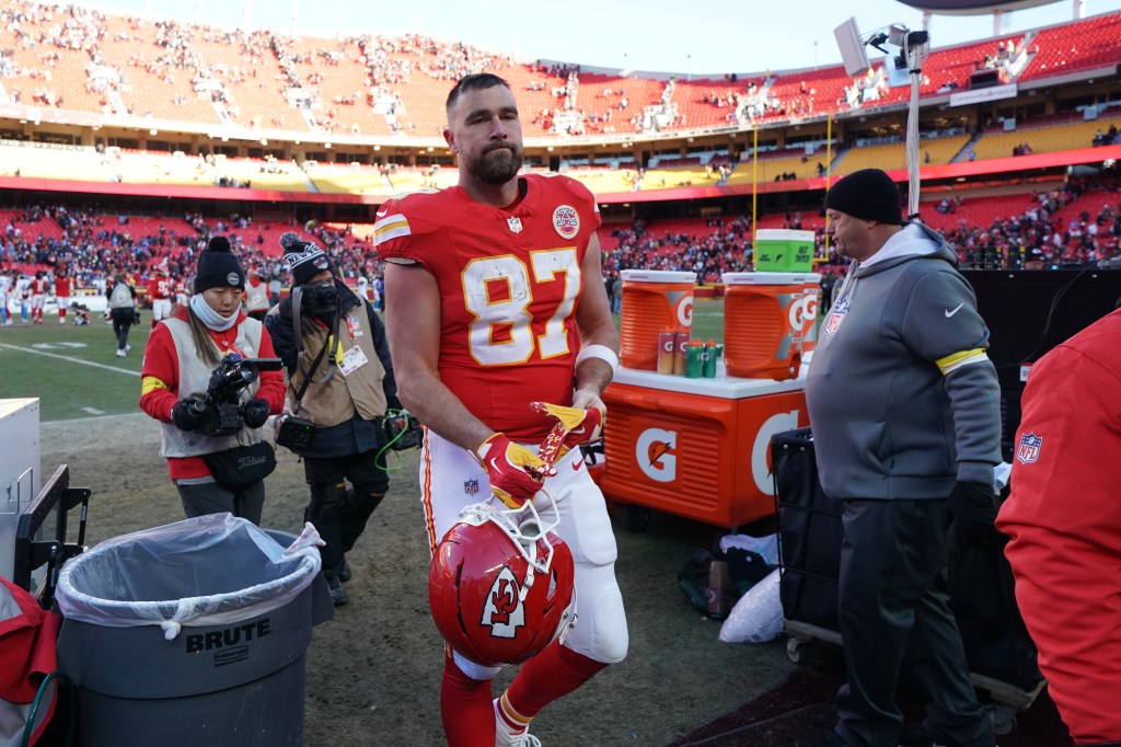 Kansas City Chiefs tight end Travis Kelce walks off the field after an NFL football game.