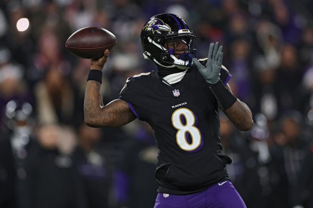 Lamar Jackson #8 of the Baltimore Ravens passes the ball against the New England Patriots during the first quarter at M&T Bank Stadium on December 21, 2025 in Baltimore, Maryland. 