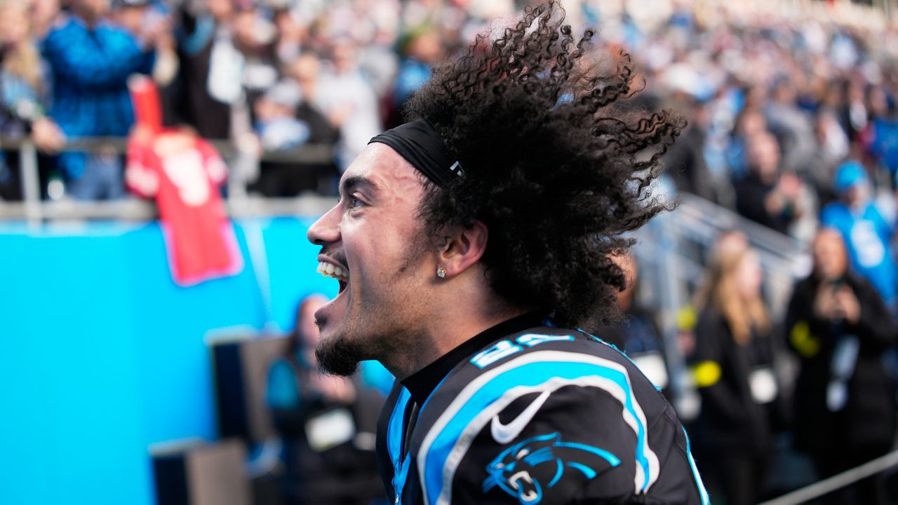 Carolina Panthers safety Lathan Ransom celebrates after their win in an NFL football game between the Carolina Panthers and the Tampa Bay Buccaneers, Sunday, Dec. 21, 2025, in Charlotte, N.C. (AP Photo/Jacob Kupferman)