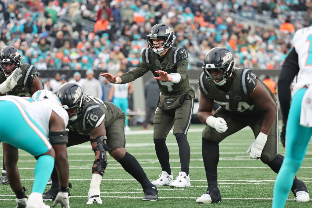 New York Jets quarterback Brady Cook #4 calls a play during the fourth quarter.