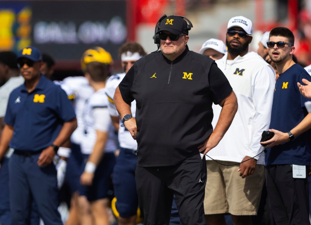 Biff Poggi watches as his team plays against Nebraska during the first half of an NCAA college football game Saturday, Sept. 20, 2025, in Lincoln, Neb. 