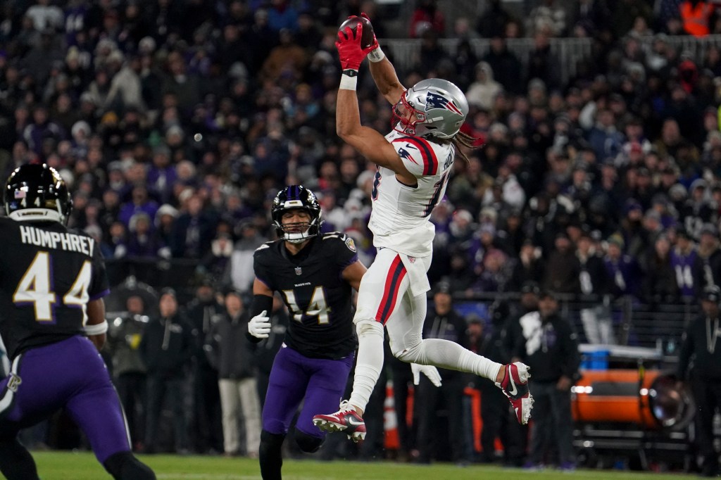 New England Patriots wide receiver Mack Hollins (13) makes a catch against Baltimore Ravens safety Kyle Hamilton (14).