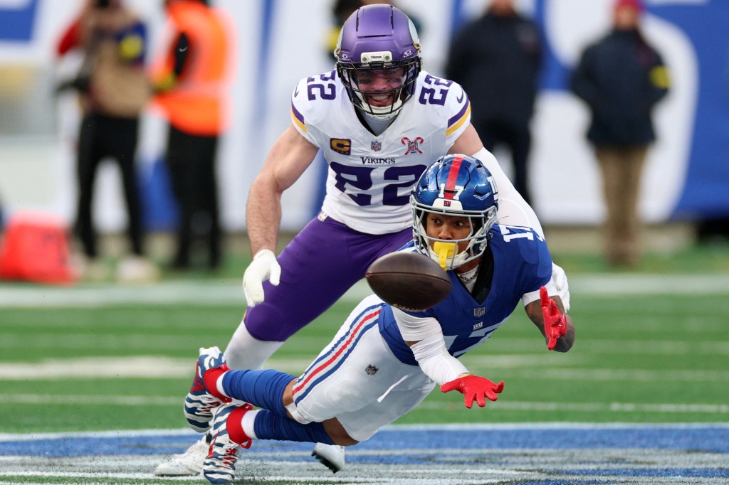 New York Giants wide receiver Wan'Dale Robinson (17) makes a catch against Minnesota Vikings free safety Harrison Smith (22).
