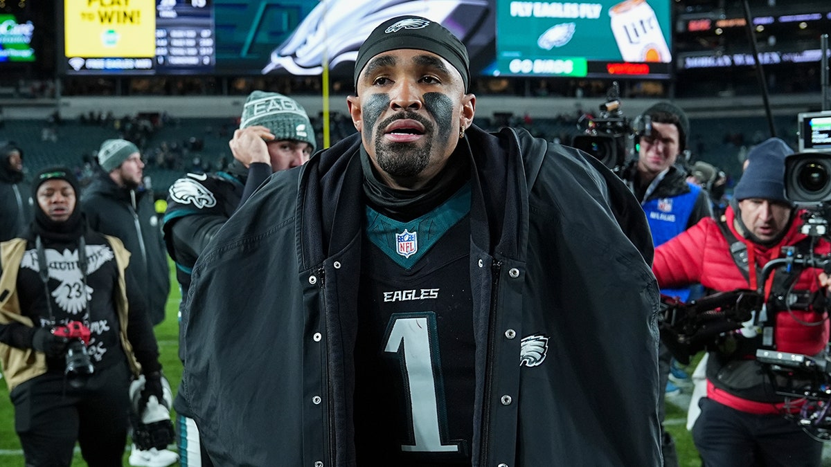 Jalen Hurts walks off the field