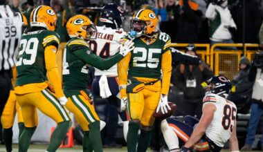 Green Bay Packers cornerback Keisean Nixon (25) celebrates after an interception against Chicago Bears tight end Cole Kmet (85) during the second half of an NFL football game Sunday, Dec. 7, 2025, in Green Bay, Wis.