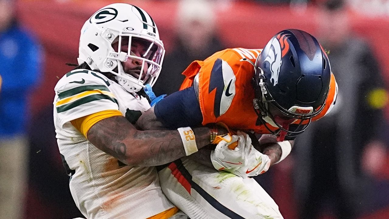 Green Bay Packers' Keisean Nixon tries to stop Denver Broncos' Troy Franklin during the second half of an NFL football game Sunday, Dec. 14, 2025, in Denver.