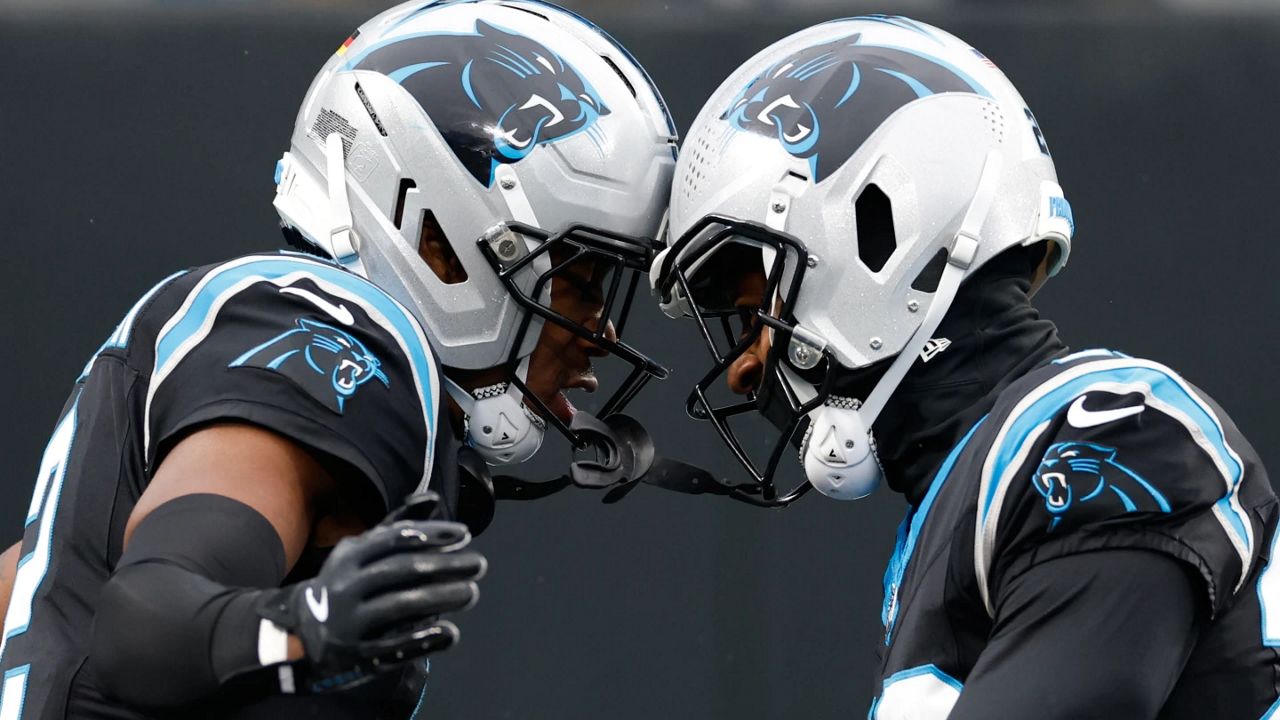 Carolina Panthers cornerback Mike Jackson, left, celebrates his touchdown against the Los Angeles Rams with cornerback Akayleb Evans in the first half of an NFL football game, Nov. 30, 2025, in Charlotte, N.C. (AP Photo/Rusty Jones, File)