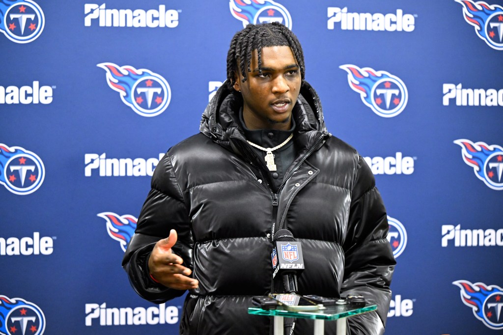 Tennessee Titans quarterback Cam Ward responds to a question during a news conference.