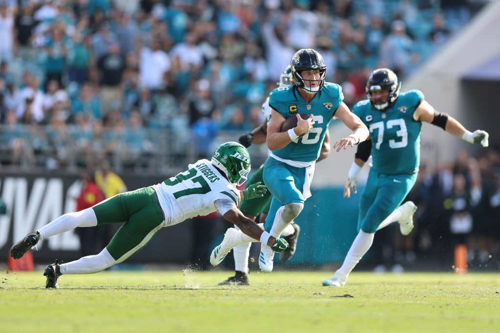 Trevor Lawrence #16 of the Jacksonville Jaguars scrambles during the second quarter against the New York Jets.