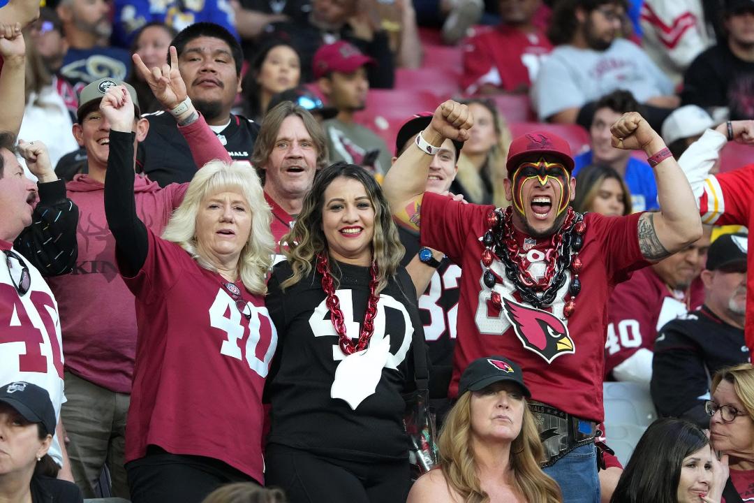 L to R: Pat Tillman fans Sharon Armstrong and Christina Tarin, the Ultimate Birdgang Warrior (Photo courtesy Eric Tarin)