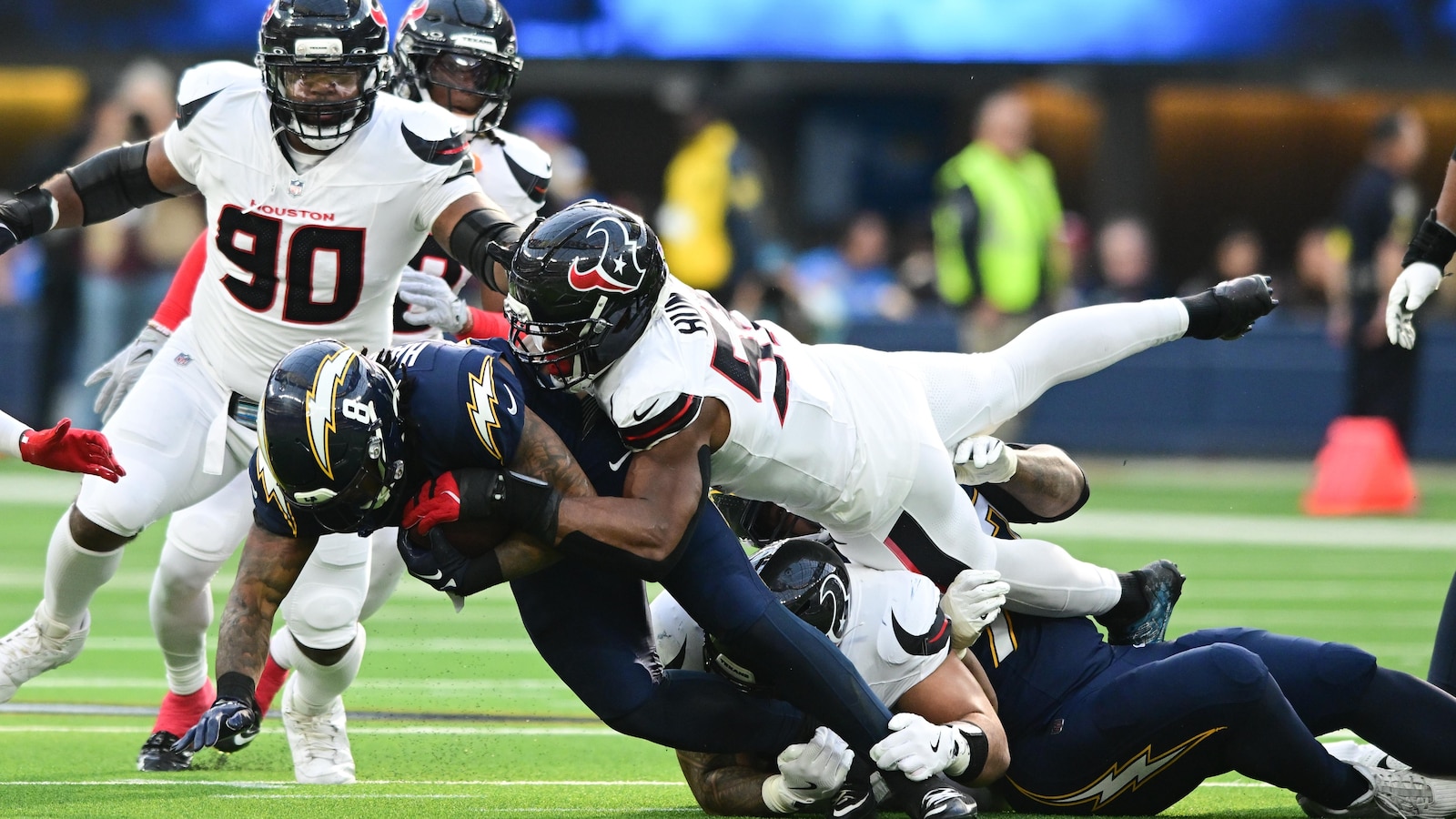 Texans' defense swarms Chargers after offense's fast start in playoff-clinching victory