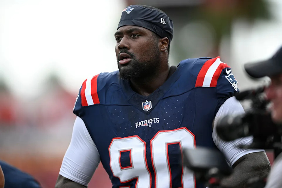 FILE - New England Patriots defensive tackle Christian Barmore (90) warms up before an NFL football game against the Tampa Bay Buccaneers, Sunday, Nov. 9, 2025, in Tampa, Fla. (AP Photo/Phelan M. Ebenhack, File)
