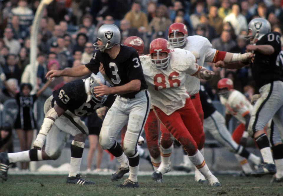 Dec 12, 1970; Oakland, CA, USA; FILE PHOTO; Oakland Raiders quarterback Daryle Lamonica (3) is pressured by Kansas City Chiefs defensive tackle Buck Buchanan (86) at the Oakland Coliseum. Mandatory Credit: Dick Raphael-USA TODAY Sports