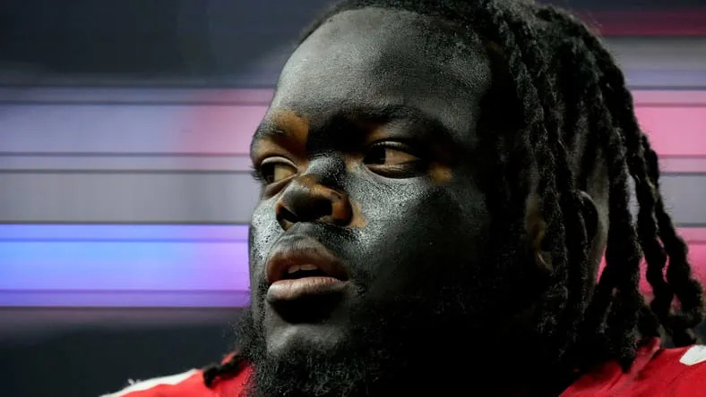 Kayden McDonald on the field before the Big Ten Championship.