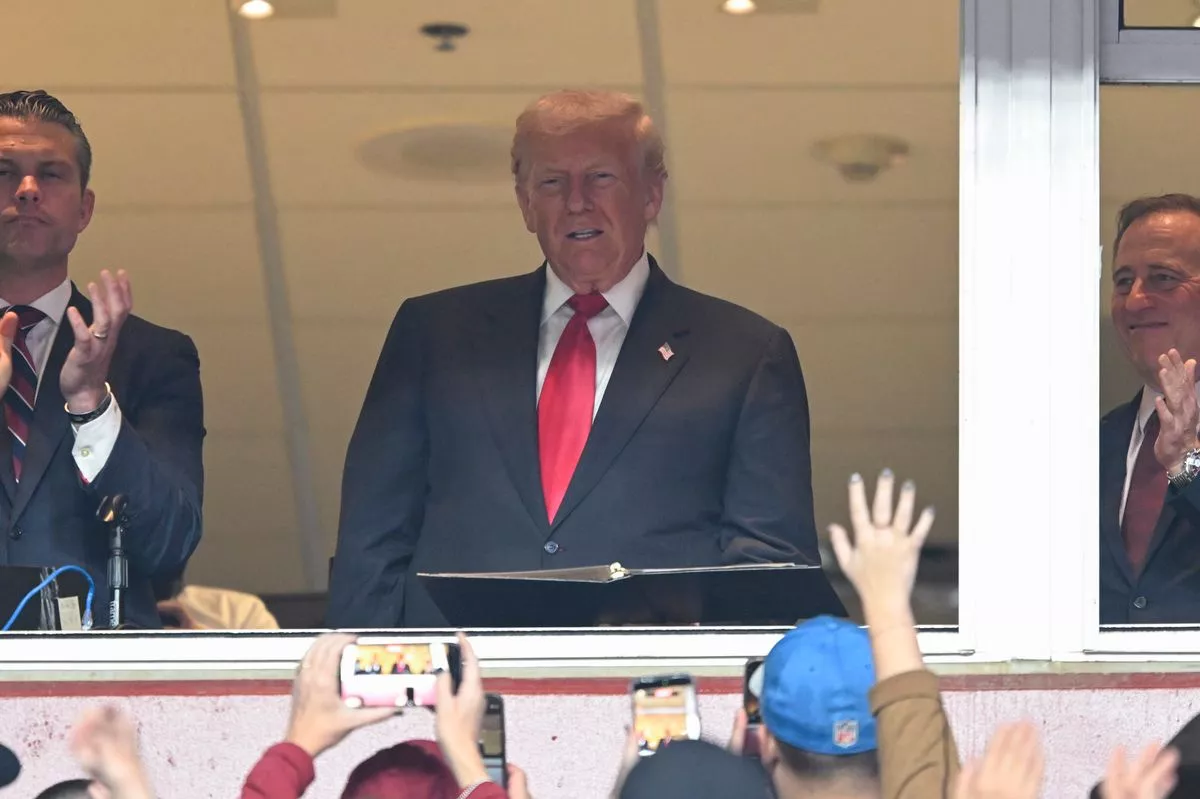 Secretary of War Pete Hegseth, U.S. President Donald Trump and Commanders team owner Josh Harris at the Commanders vs. Lions NFL game