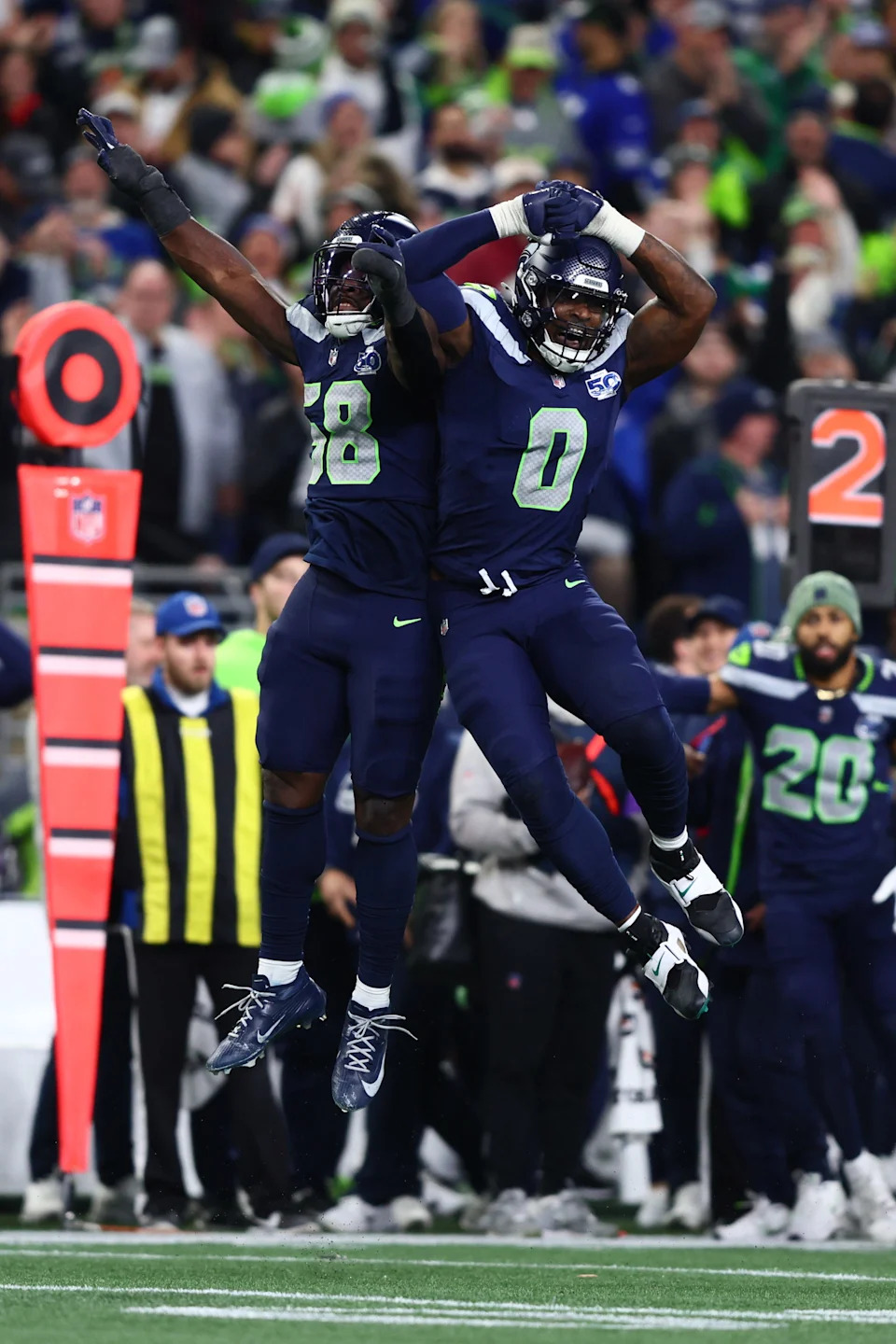 Jan 17, 2026; Seattle, WA, USA; Seattle Seahawks linebacker Derick Hall (58) and defensive end DeMarcus Lawrence (0) react after a strip sack of San Francisco 49ers quarterback Brock Purdy during the second half in an NFC Divisional Round game at Lumen Field. Mandatory Credit: Kevin Ng-Imagn Images