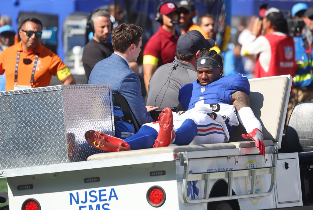 Wide receiver Malik Nabers #1 of the New York Giants is carted off the field after he is injured jumping for a reception during the first half when the New York Giants played the Los Angeles Chargers Sunday, September 28, 2025 at MetLife Stadium in East Rutherford, NJ.